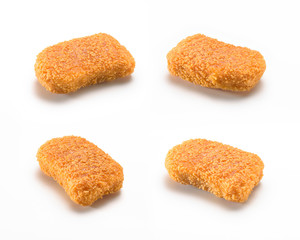 Four diferents sizes and shapes of a crispy and delicious chicken nuggets, isolated on white background. A popular fast food  made from chicken meat that is breaded or battered, then deep-fried or bak