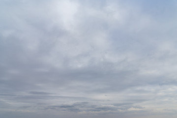 Dark blue sky with light clouds