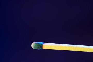 Lit matches and blown out in the studio photographed with colorful foils before the flashes