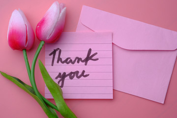 Close up of thank you note with tulip flower