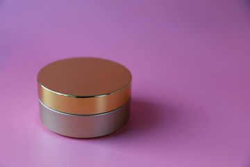 Blank cosmetic box container for cream on pink even background