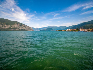 Obraz premium Lago di Garda in northern Italy, family tourism boats, crystal clear water, summer holidays vacations
