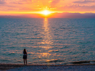 Fototapeta premium Lago di Garda in northern Italy, family tourism boats, crystal clear water, summer holidays vacations