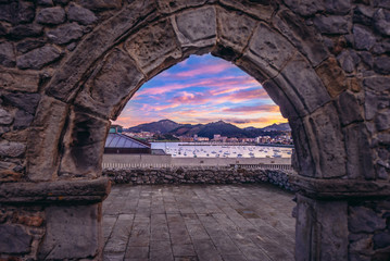 Fototapeta na wymiar Ruined wall of Saint Peter hermitage over bay in Castro Urdiales seaport in Cantabria region, Spain