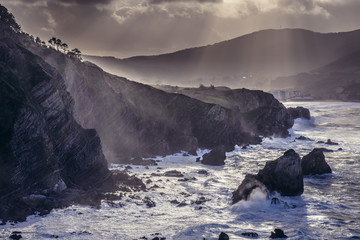Shore of Biscay Bay of the northeast Atlantic Ocean seen from Gaztelugatxe isle in Spain