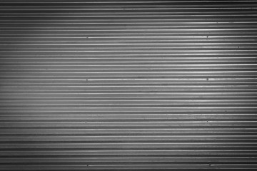 Metal texture pattern, ribbed cast iron surface, textured black background , wall for dark backdrop , loft style interior.