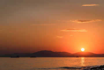 Beautiful, colorful sunset on the sea. Vacation and weekend concept