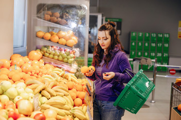 Woman in a supermarket. Beautiful Lady in a mall