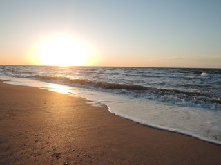 Fototapeta na wymiar Soft Sea Ocean Waves Wash Over Golden Sand Background in summer