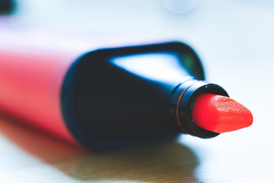 Close-Up Of Red Felt Tip Pen On Table