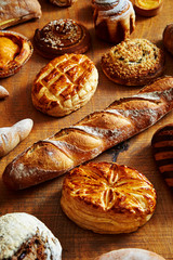 Various bread on wooden table 