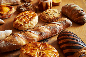 Various bread on wooden table 