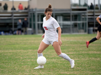 Girl Soccer player making exciting plays during a game © Joe