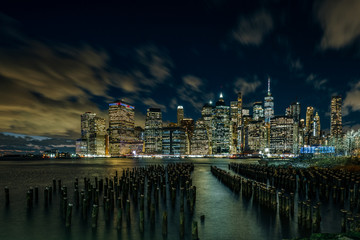 Fototapeta na wymiar Night light Over East River Lower Manhattan Skyline View From Brooklyn Bridge Park