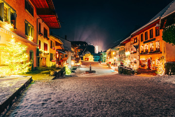 Christmas Gruyeres town village at Switzerland in winter at night
