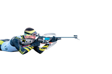 Isolated biathlon skier with rifle in shooting prone position