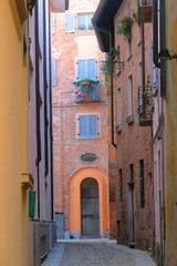 vicolo in centro a pavia in italia, alley in the center of pavia in italy