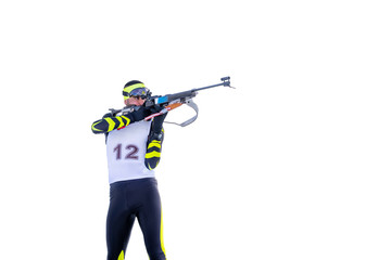 Isolated biathlete shoots with rifle in a standing position