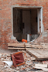 the empty doorway of the collapsed houses, buildings
