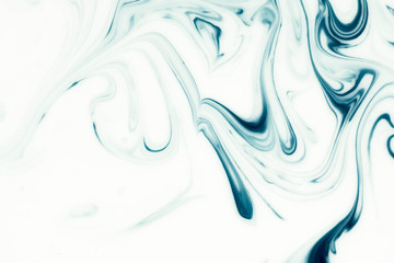 Modern blue paint smudges, fashionable texture, background made of blurred ink and milk, looks like marble