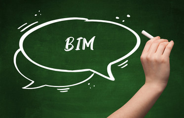Hand drawing BIM abbreviation with white chalk on blackboard