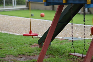 Amusement park with red swing