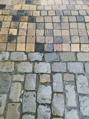 Vintage traditional stone pavement and new modern square pavement. Cobblestone pavement texture and abstract background concept.