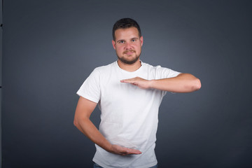 Young handsome young man wearing casual clothes over isolated background gesturing with hands...