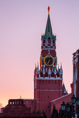 Fototapeta na wymiar Moscow, Russia - March 22, 2019: Sunrise over the city of Moscow, the capital of Russia. Vertical view of the Spasskaya Tower and the mausoleum on Red Square.