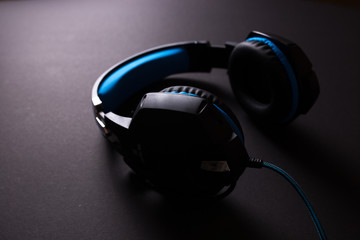 Black headphones on dark background