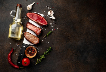 Three pieces of meat grilled over a meat knife. Three types of frying meat, rare, medium, well done...