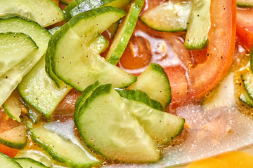Fresh tomato and cucumber salad close up photo