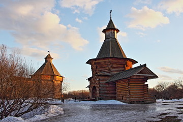 Moscow, Russia, Wooden church and ancient tower in Kolomenskoe Park museum, old Russian wooden house at Sunny winter day