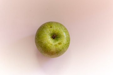 Close up of a granny green apple from above
