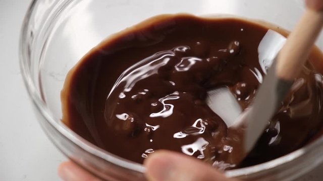pastry chef preparing chocolate batter for cake and brownies.