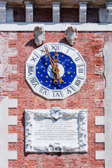 Old clock on the Arsenal building in Venice. Date of construction 1570
