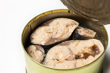 Canned fish in an iron can on white background