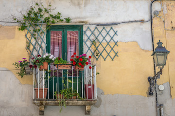Balcony of old town house in Trapani, capital of Trapani Province on Sicily Island in Italy
