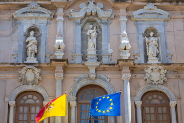 Fototapeta na wymiar Details of facade of Cavarretta palace in Trapani, capital of Trapani Province on Sicily Island in Italy