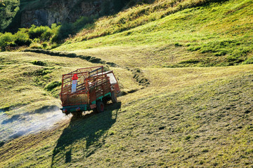 Agricultural vehicle with the hay in the meadow in Zermatt, Switzerland.
