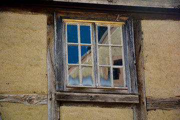 Old window with wooden frame at an old castle in Germany