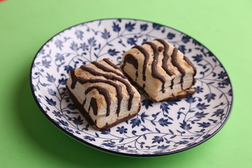 small chocolate cakes in color background