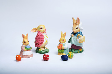 bunny family, mother, father children with easter eggs