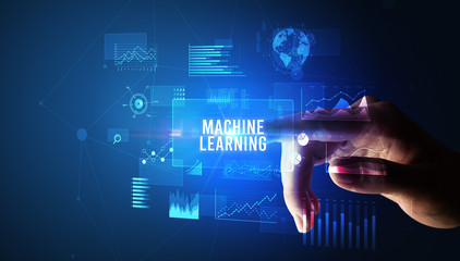 Hand touching MACHINE LEARNING inscription, new business technology concept