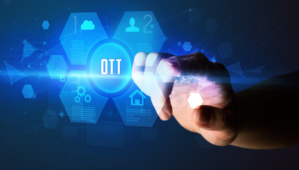 Hand touching OTT inscription, new technology concept