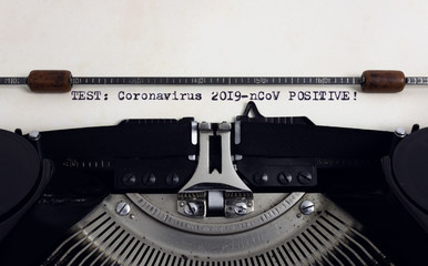 Old retro vintage typewriter with typed heading Test Coronavirus 2019-nCoV positive