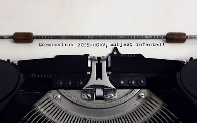 Old retro vintage typewriter with typed heading Coronavirus 2019-nCov Subject infected