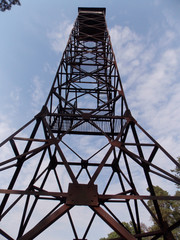 high voltage tower on a background of blue sky