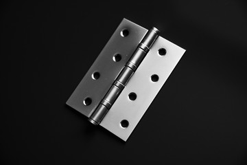 Door hinges, hold the door, on a black background