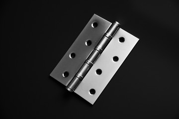 Door hinges, hold the door, on a black background